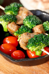 Nice meat kebab with broccoli on skewers