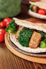 Vegetarian seitan with vegetables inside pita bread.