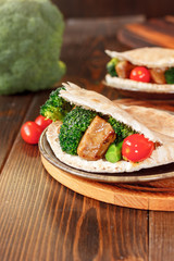 Meat with vegetables in a pita bread.