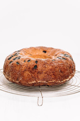 Traditional German or Austrian Gugelhupf or Kouglof from Alsace, France, a round bundt cake with raisins made of brioche yeast sponge or sweet bread dough and dusted with sugar