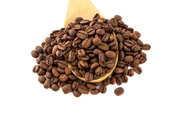 Coffee grains in a wooden spoon. Roasted coffee beans close-up in a wooden spoon.