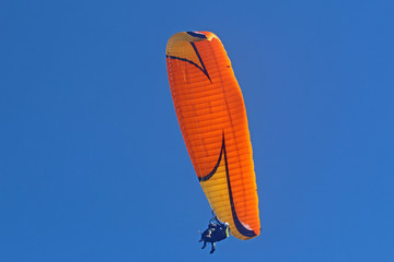 Tandem paraglider flying