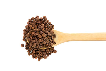 Coffee grains in a wooden spoon. Roasted coffee beans close-up in a wooden spoon.