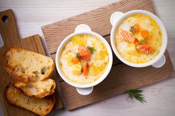 Salmon soup. Two bowls of creamy salmon fish soup. Clean eating, healthy and diet food concept