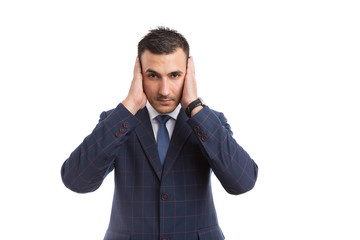 Businessman banker or sales man covering his ears.