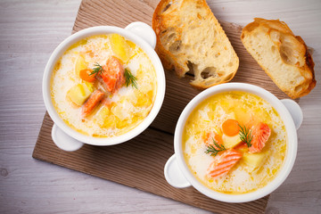 Salmon soup. Two bowls of creamy salmon fish soup. Clean eating, healthy and diet food concept
