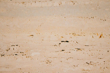 Texture of natural beige limestone. Copy space stone background.