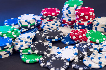 Poker chips isolated on black background
