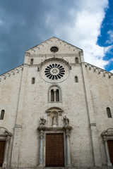 Fototapeta na wymiar Vertical View of the Front Side of The Cathedral of San Basilio on Cloudy Sky Background. Bari, South of Italy