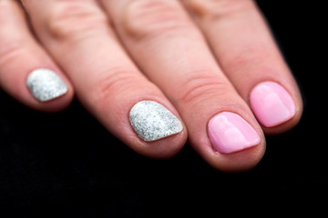 Stylish female manicure, pink and shiny