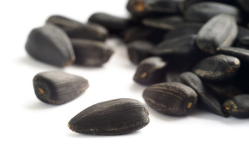 Black sunflower seeds isolated on white background