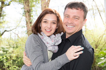 fun and love with happiness couple outdoor in summer day hugging