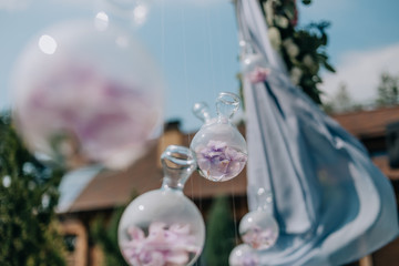Wedding decor flowers and glass flasks