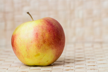 Ripe red apple on light background