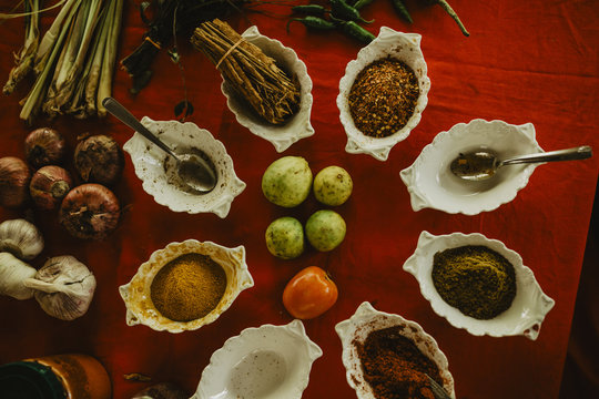 Spices on red table
