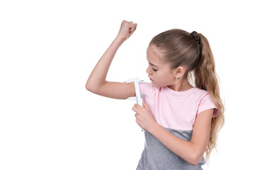 Girl measures the muscles with a caliper