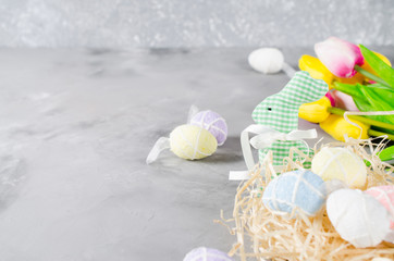 Easter composition with bunny, eggs and tulips.