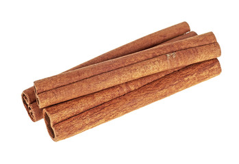 Cinnamon spice isolated on white background. Three cinnamon sticks.