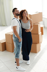 Fototapeta na wymiar married couple standing in new apartment