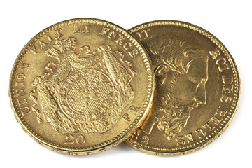 Belgian 20 Francs gold coins isolated on white background