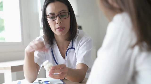 Doctor prescribing medication to patient 