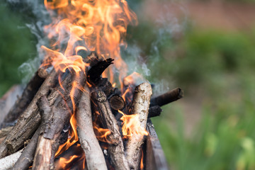 Fire burns on the grill, preparation for frying meat