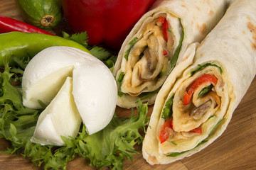 Fresh tortilla wrap with mozzarella and  vegetables