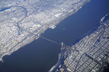 Aerial view of the George Washington Bridge over the Hudson River between New York and New Jersey after a winter snow storm in New York City