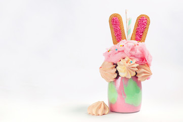 Easter freak shake topping with bunny ears cookies and cotton candy