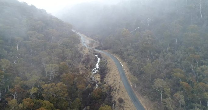Bad weather heavy snowfall in Snowy Mountains national park over Guthega road towards Snowy River in winter.
