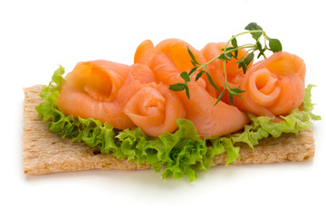 Bread with fresh salmon fillet isolated on white background, top view.