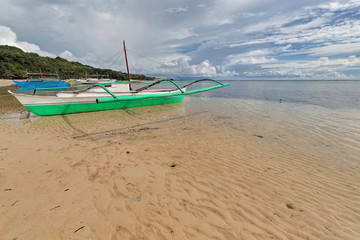 Fototapeta na wymiar Balangay or bangka boats ashore. Punta Ballo beach-Sipalay-Philippines. 0293