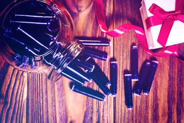 gift box with red bow and fountain pen ink cartridges on wooden background. Back to school, world...