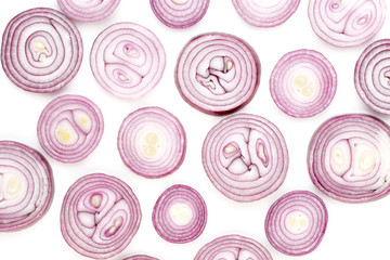 Onion isolated on white background, top view. Wallpaper abstract composition of vegetables.