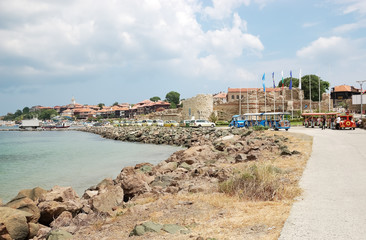 Fototapeta na wymiar View of the bay, the seafront and part of the ancient fortress wall of the old Nessebar.