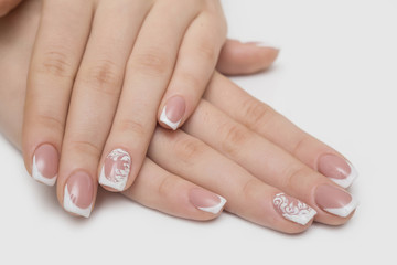 Women's hands with clean manicure. Gel polish applied.