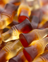 A Background of Cola Flavored Gummies