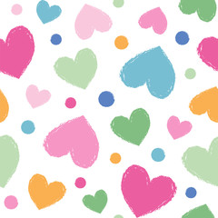Seamless vector pattern with paintbrush hearts in cute colors.