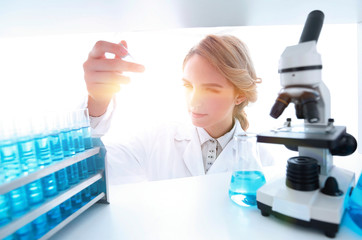 Young woman analyzing samples in a lab