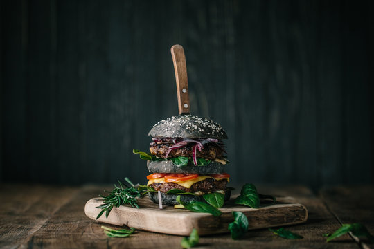Delicious double black burger with spinach and beef 