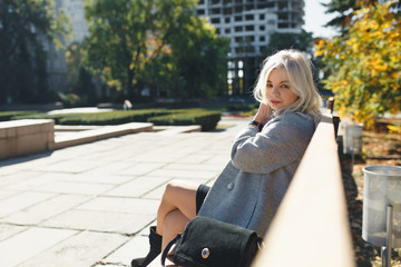 girl is walking in the park, a fashionable girl on an autumn walk