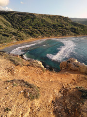 Fototapeta na wymiar Comino island blue lagoon. Malta blue turquoise sea water beach. Rock and cliff sunny seashore. Travel mediterranean.