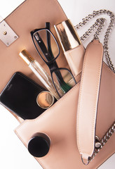 Fashion lady accessories set. Flat lay. Stylish handbag. Make-Up brushes.Women accessories. Trendy fashion design.