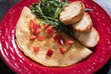 Omelet, fried chicken eggs with fresh vegetables