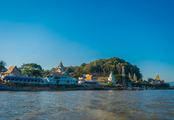 Outdoor view of houses and buildings at the riverbank located at golden triangle Laos