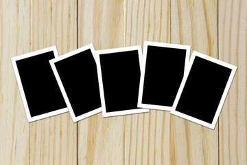 Photo frame blank on wood background with space