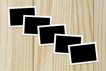 Photo frame blank on wood background with space