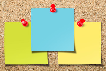 Cork board with three sticky notes