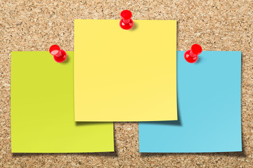 Cork board with three sticky notes