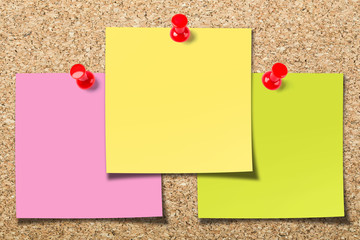 Cork board with three sticky notes